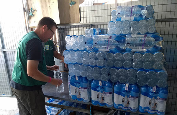 More than 9,000 plastic water bottles are distributed every day in the Moria refugee camp.