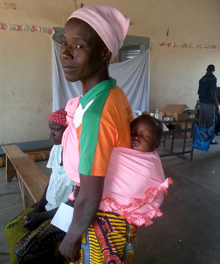 A woman carrying a young child was a common sight at Reach Beyond's recent medical caravan in Burkina Faso.