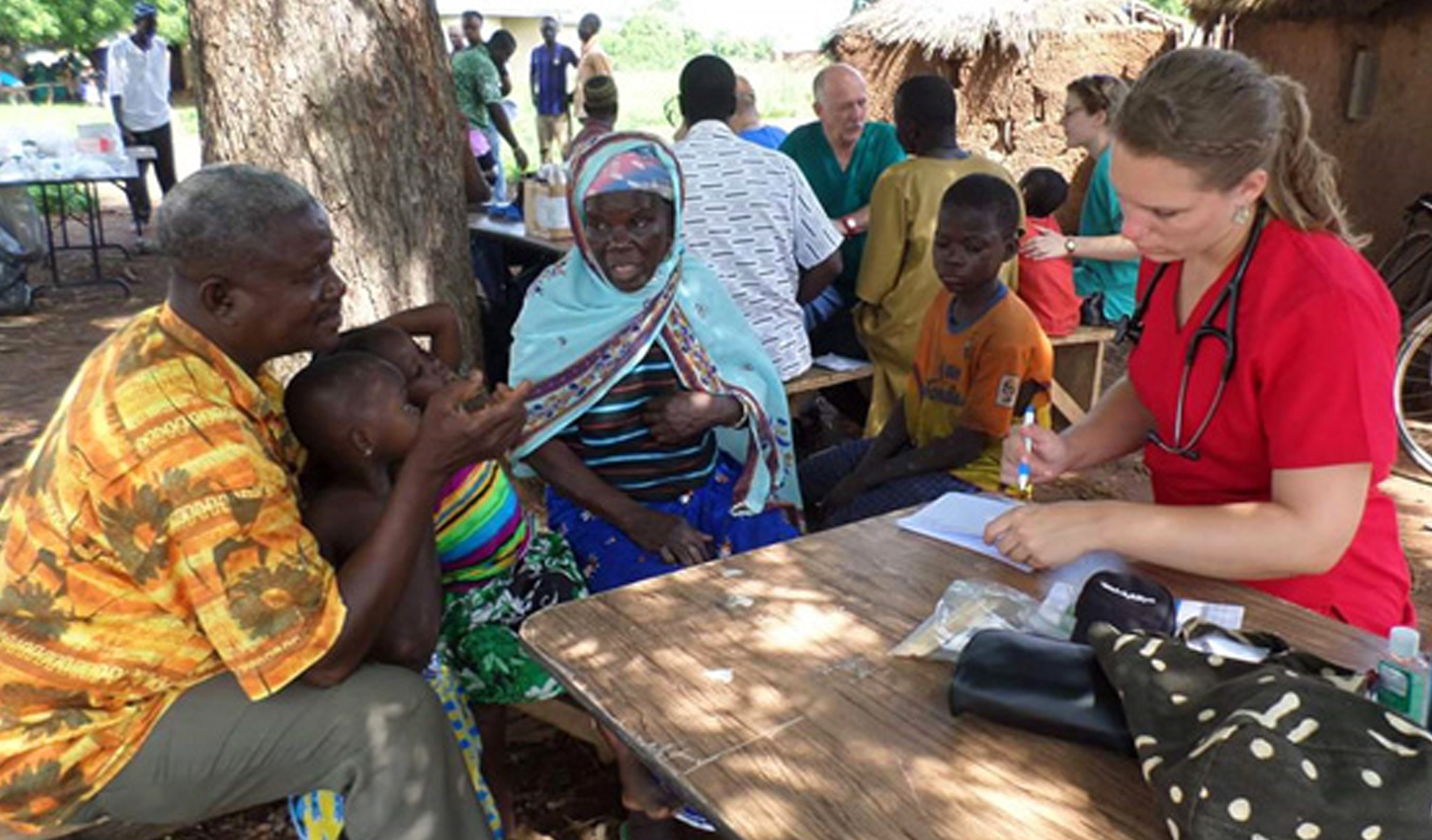 Former intern Staci Pessetti works with patients at a clinic in a remote village of northern Ghana.