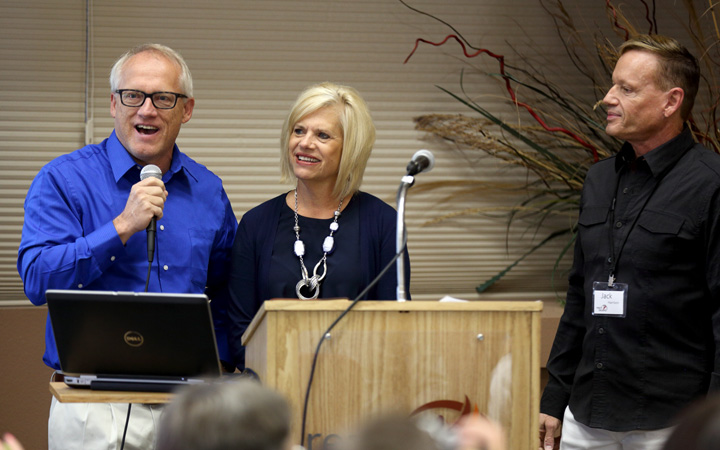 Steve and Becky Harling tell about their family while Jack Harrision, a member of the Reach Beyond board and chair of the presidential selection and transition team, looks on. 