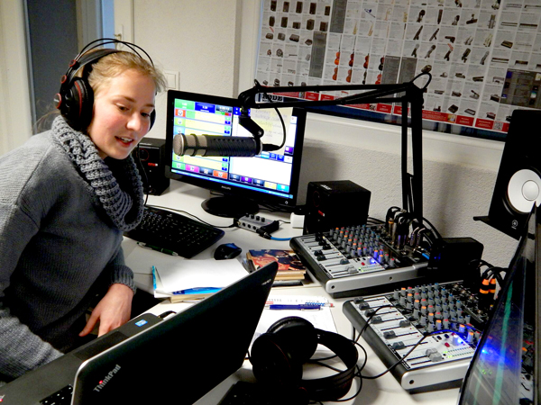 A staff member at Reach Beyond's partner in Croatia records a radio program.