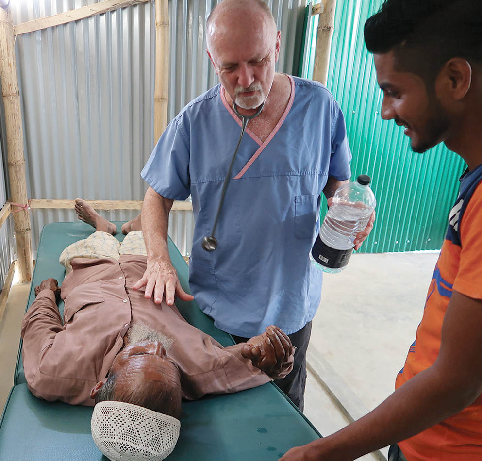 Dr Steve examines a patient at a Rohingya refugee camp in Bangladesh