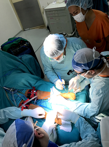 A medical team led by orthopedic surgeon Dr. Tom Novacheck performs an operation on a patient with cerebral palsy.