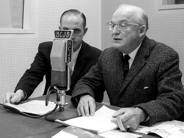 Reach Beyond co-founder Clarence Jones (right) broadcasts on Radio Station HCJB.