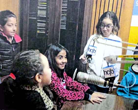 Fourth-graders from Alliance Academy Intenrational enjoy a visit in one of HCJB's recording studios.