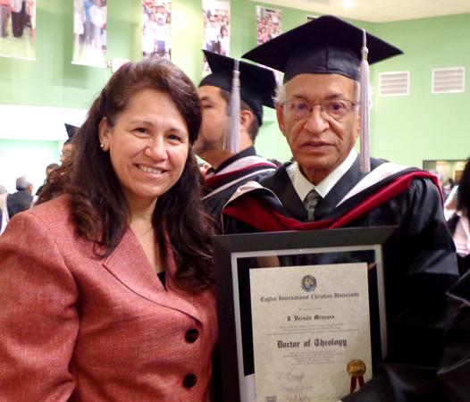 Meneses, next to his longtime assistant, Josefina Rios, receives his doctorate at the age of 78.