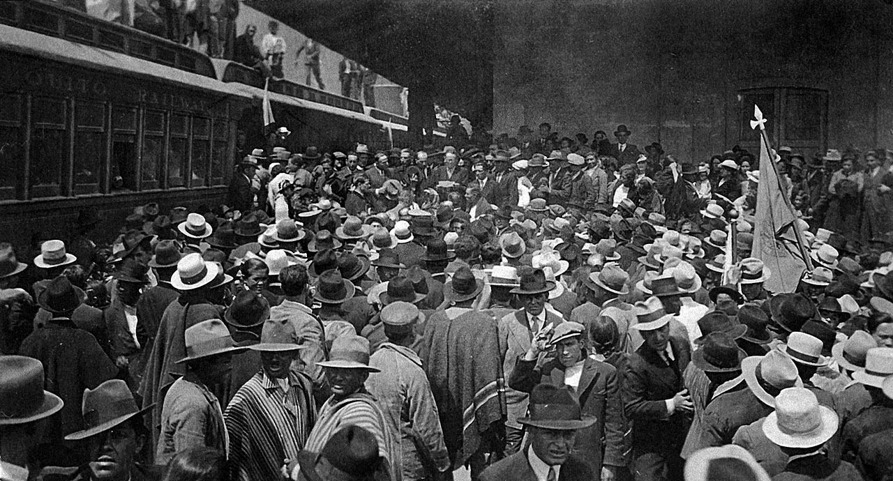 Crowds gathered around the traveling train exposition held in Ecuador during 1933 to commemorate the 25th Anniversary of the completion of the world's most difficult railroad.