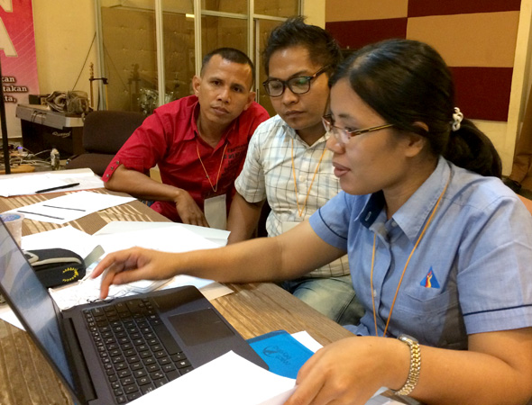 Indonesian announcers practice using a sound board during their recent training.