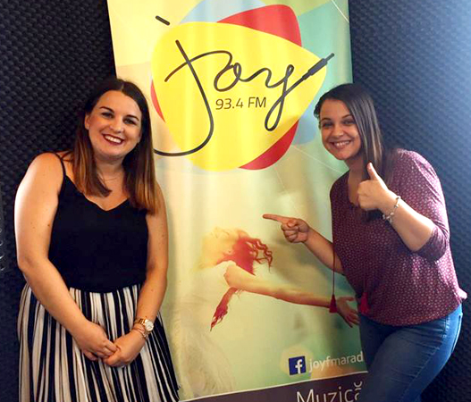 Staff members at partner station Joy FM in Arad, Romania.