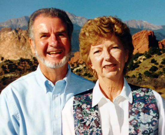 John and Marian Osborne in Colorado Springs with Garden of the Gods and Pikes Peak in the background.
