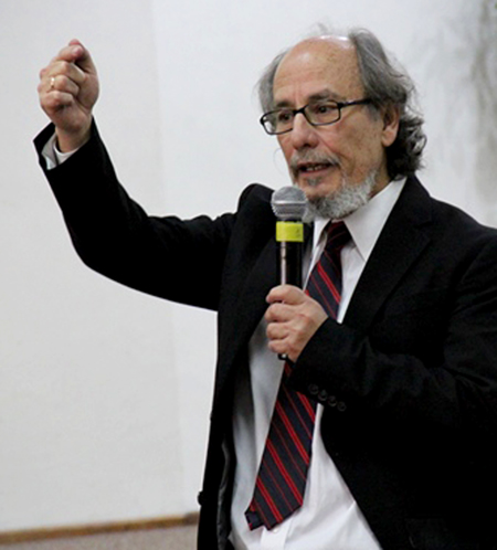 Carlos Pinto speaks at a seminar in Quito, Ecuador.