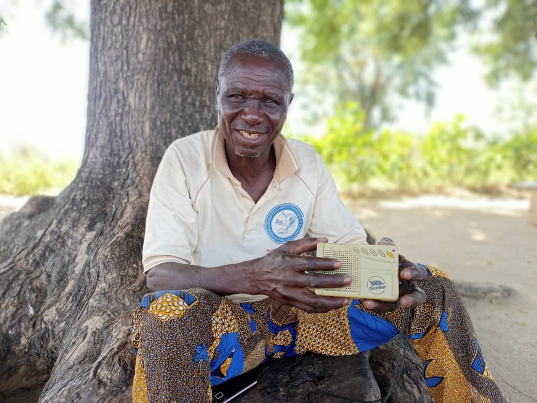Amadou with the Sonset radio that changed his life