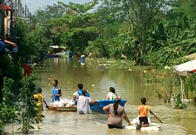 Flash floods in southern Thailand left many communities waist-deep in water.