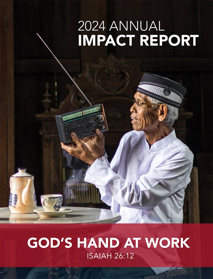 2024 Annual Impact Report cover showing an Indonesian man listening to the radio