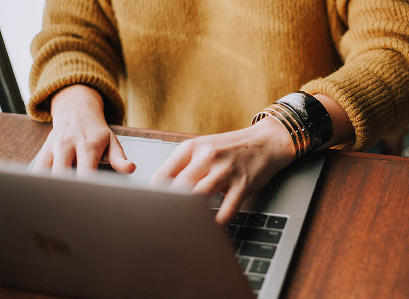woman typing on a computer