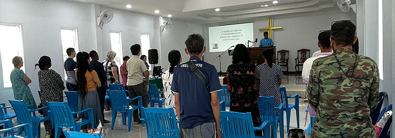 People worshipping at a small church that was planted through radio ministry in Southeast Asia