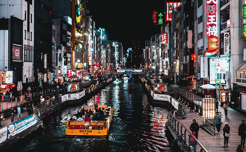 A scenic canal in a Japanese city at night