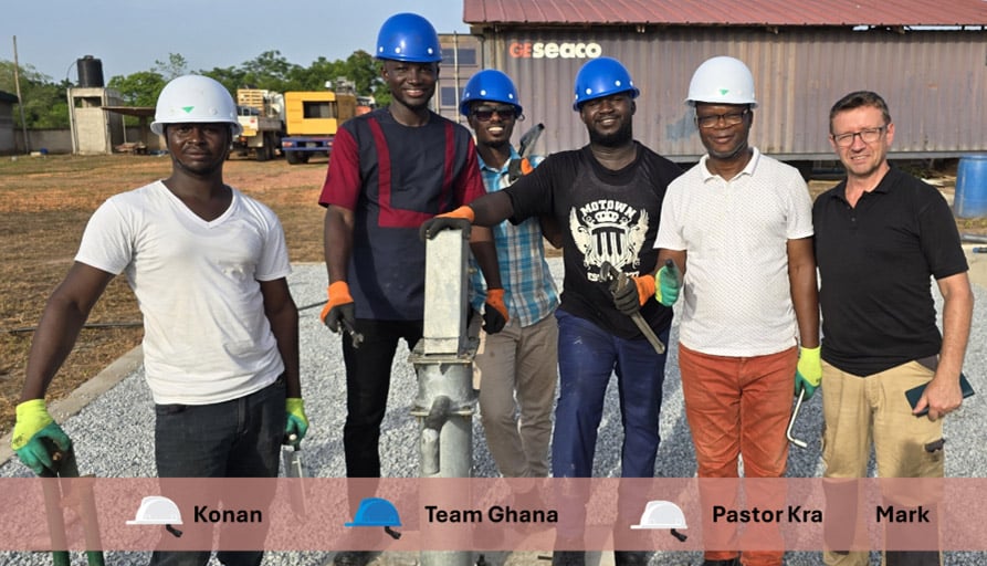 Konan, Pastor Kra  and several trainees from Ghana pose with Mark next to a well during training in Ivory Coast