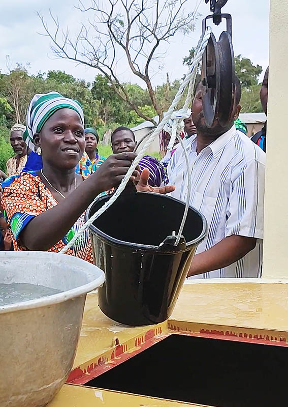 First buckets of clean water from a new well in West Africa.
