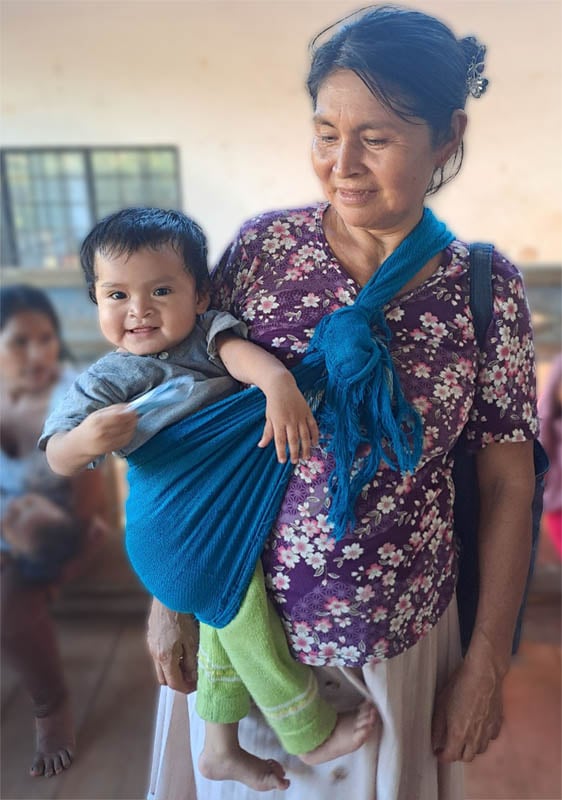 Baby J.S. being cared for by his grandma.