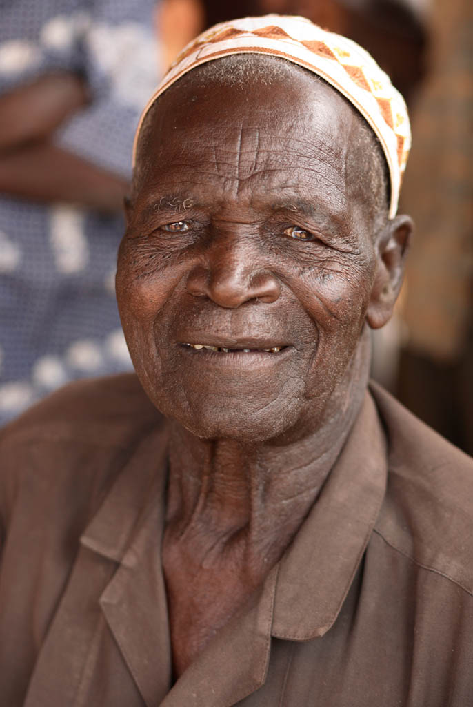 A smiling elderly Muslim man in West Africa
