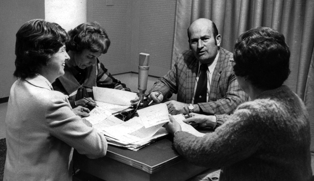 Leonard and Imogene Booker producing a radio program at the studios in Quito.