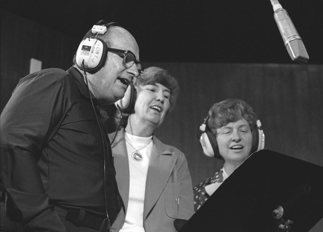 The trio of Leonard and Imogene Booker and Margaret Gowan perform on the air.