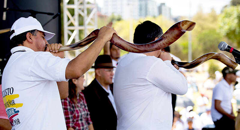 The loud sound of blowing a pair of shofars commands the attention of thousands of marchers at the event in Quito, Ecuador, Saturday, Sept. 26.