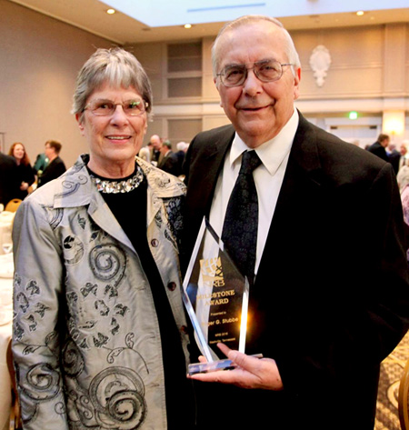 Roger (holding Milestone Award trophy) and Joyce Stubbe at the NRB convention in Nashville.