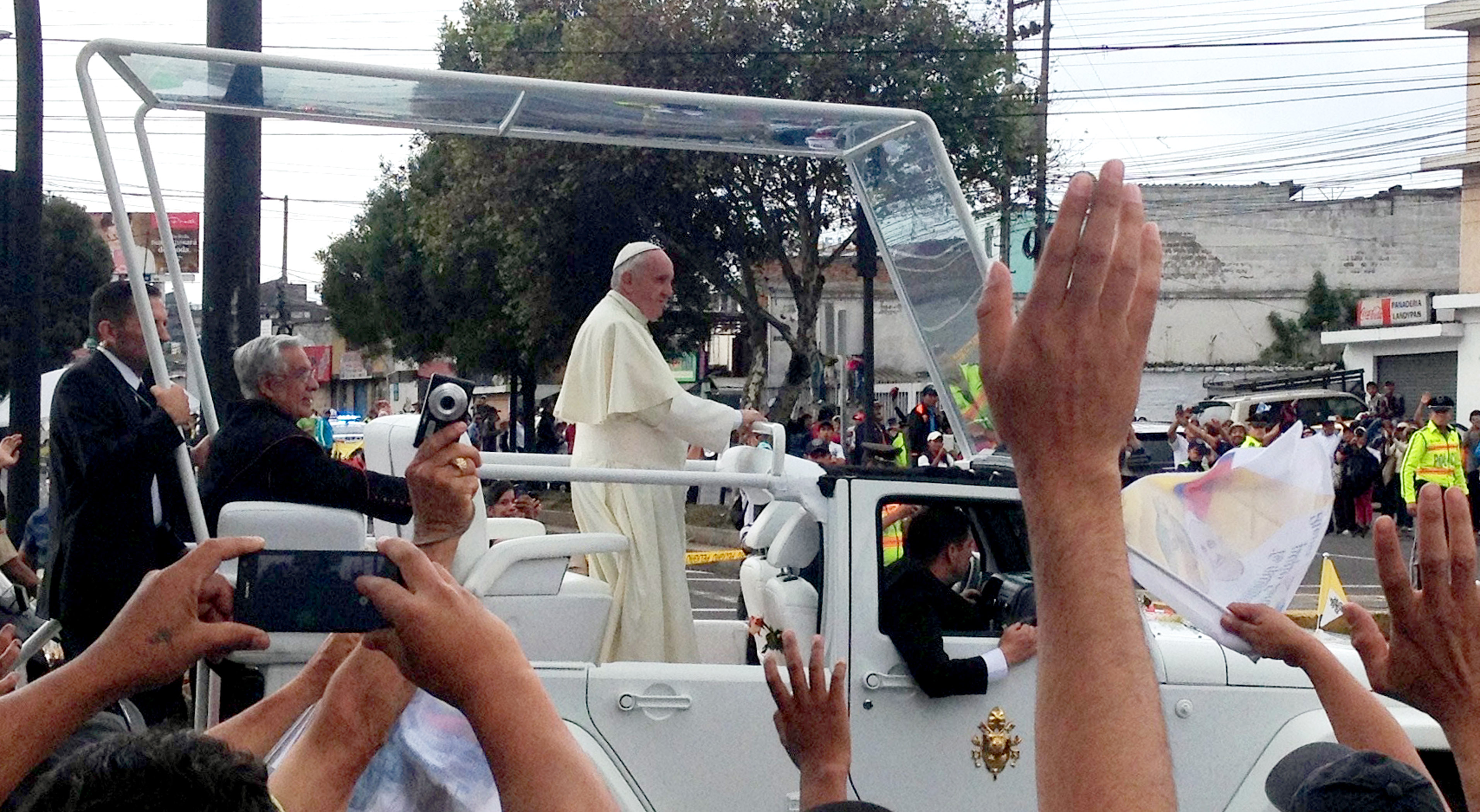 Jubilant crowds waved to Pope Francis after a Mass in Quito. Photo credit: Rob Quiring