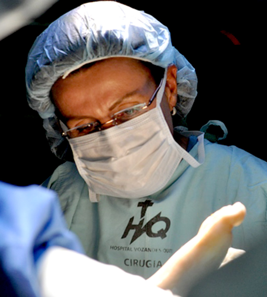Dr. Ana Maria Tedesco of Brazil helps with a surgery.