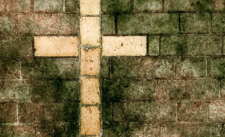 cross on brick wall